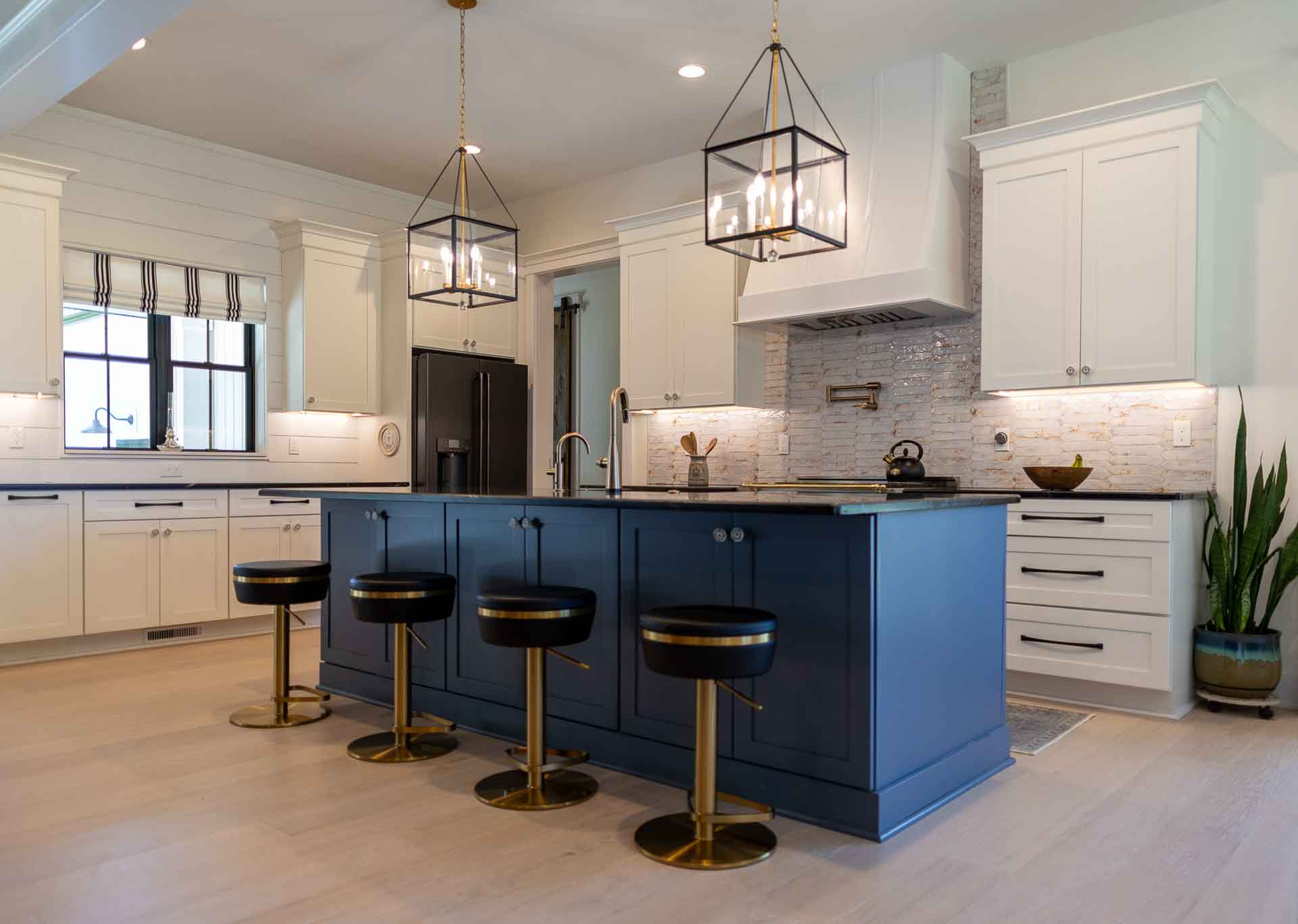 Woodline Building Company Project: Ranch Farmhouse Two-Toned Kitchen with White Cabinets & Blue Island