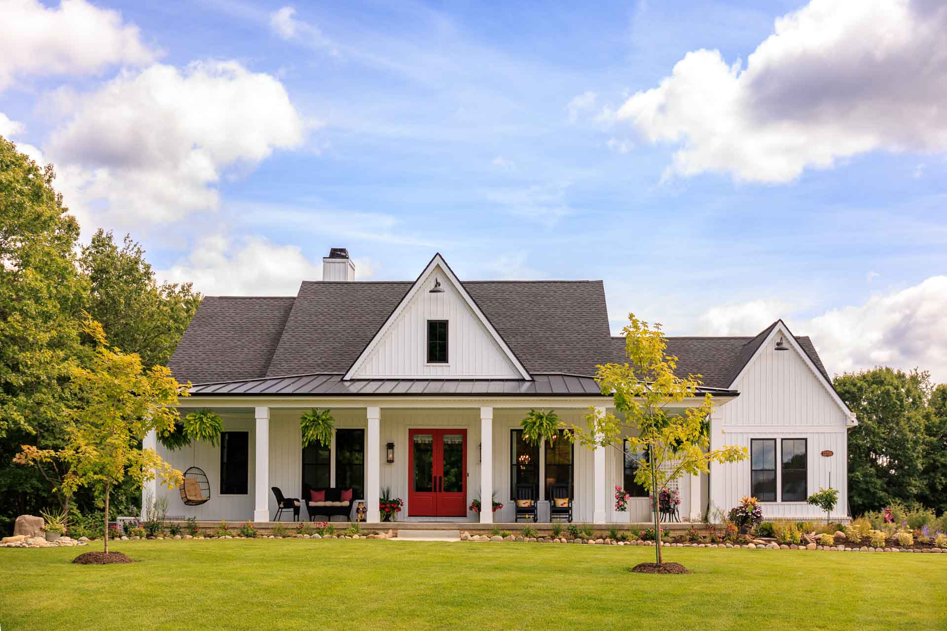 Farmhouse Ranch Holly Groveland Michigan with Large Front Porch Custom Home built by Woodline Building Company