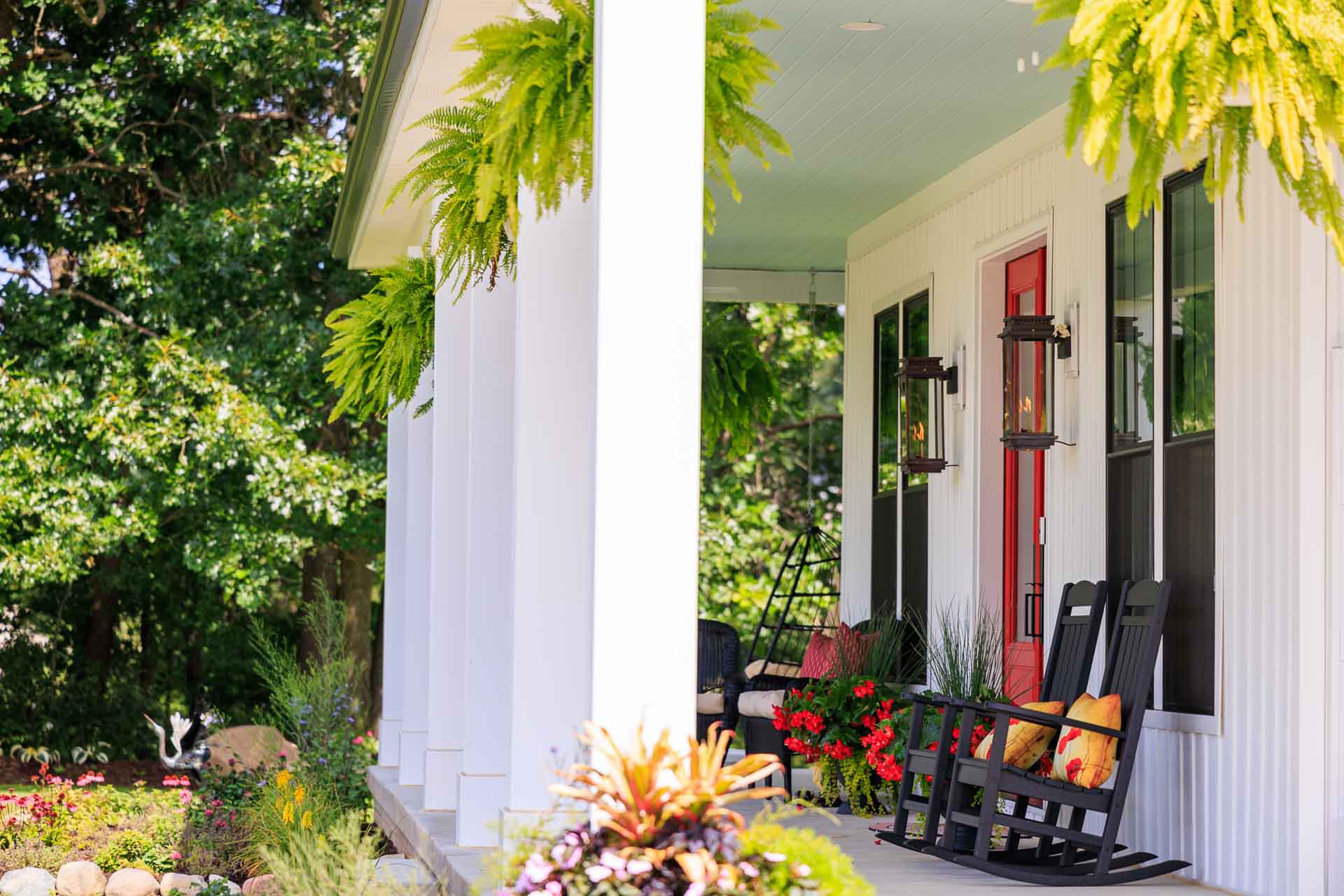 Woodline Building Company Project: Ranch Farmhouse Front Porch with Red Door and Gas Lit Lights